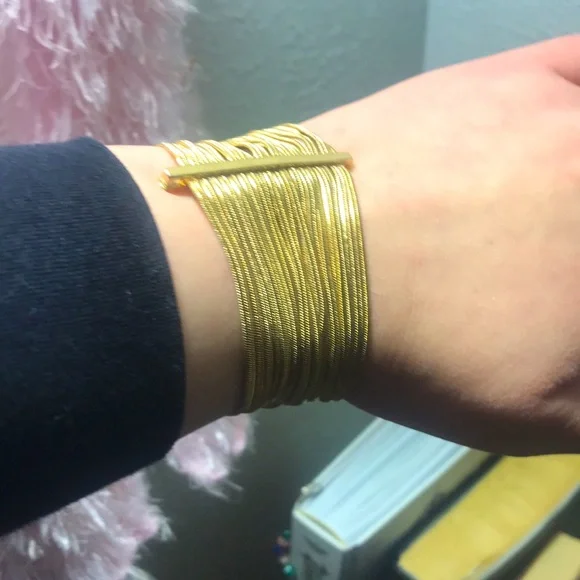 Gold colored guess bracelet with magnetic clasp